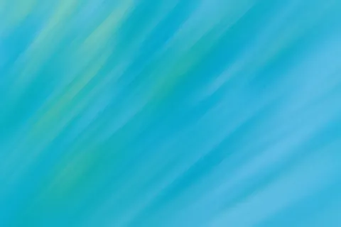 Blue and green abstract gradient background with soft diagonal streaks.